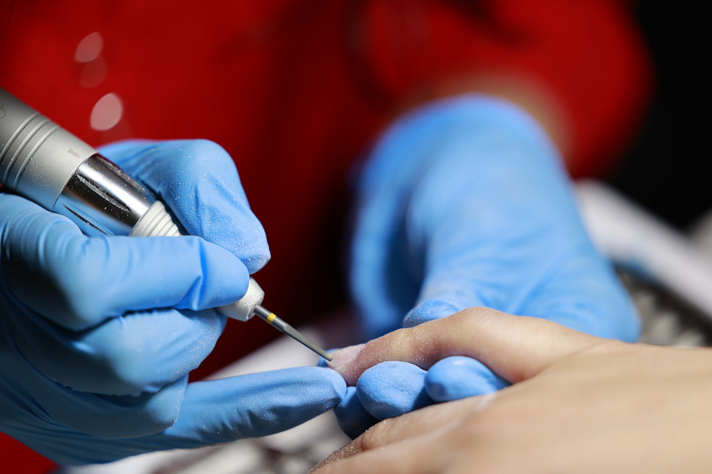 Remove gel polish and manicure while also cutting cuticles and nails.