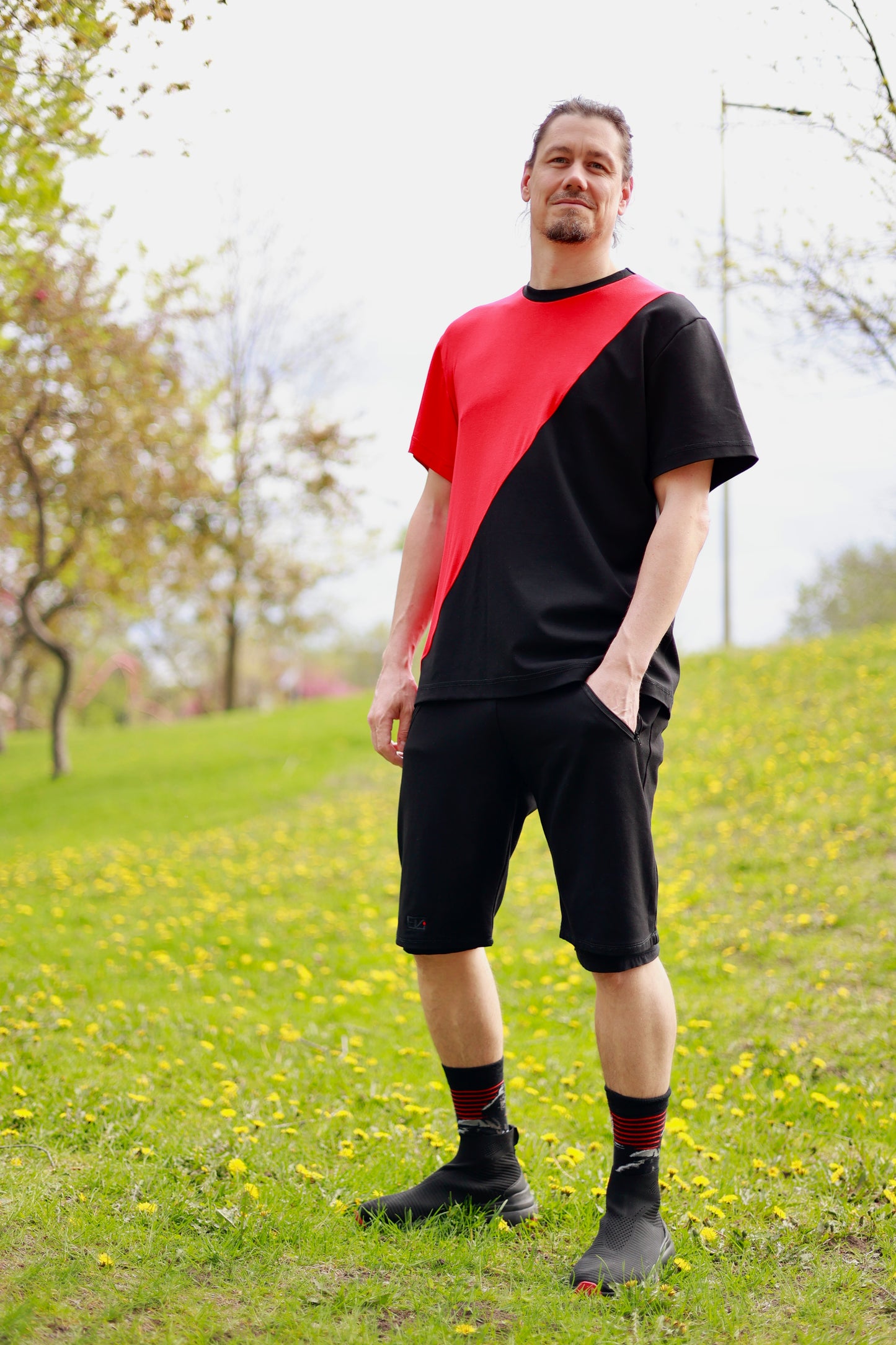 model has left hand in pocket of the nok er nok heavy shorts.