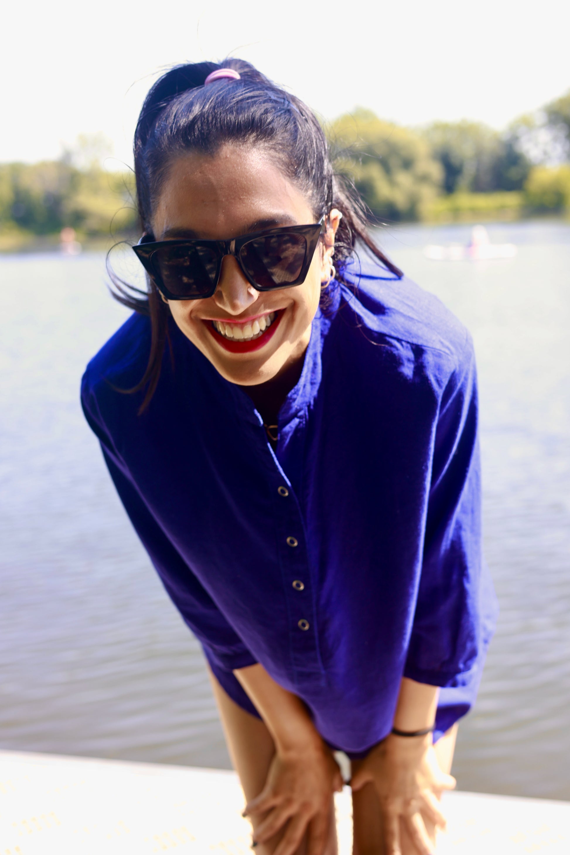 Sanaz Firouzi Wears the Blue Linen Blouse from ELZI.ca on a warm sunny day.