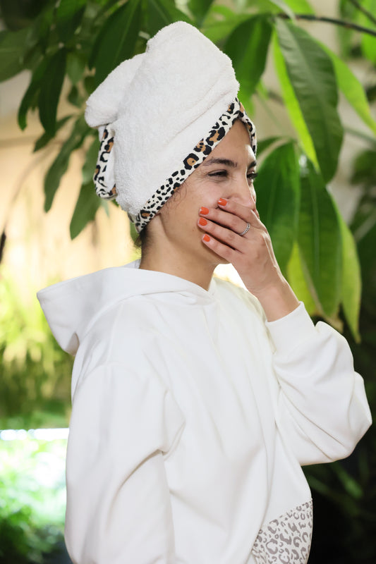 Sanaz wears an ELZI Hair Drying Towel Cap with Leopard border.
